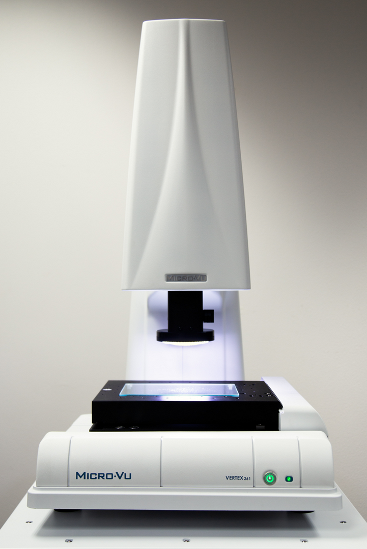 Vertex Micro-Vu Product Full view of white Vertex Micro-Vu Product with microscope objective over the black viewing stage.
