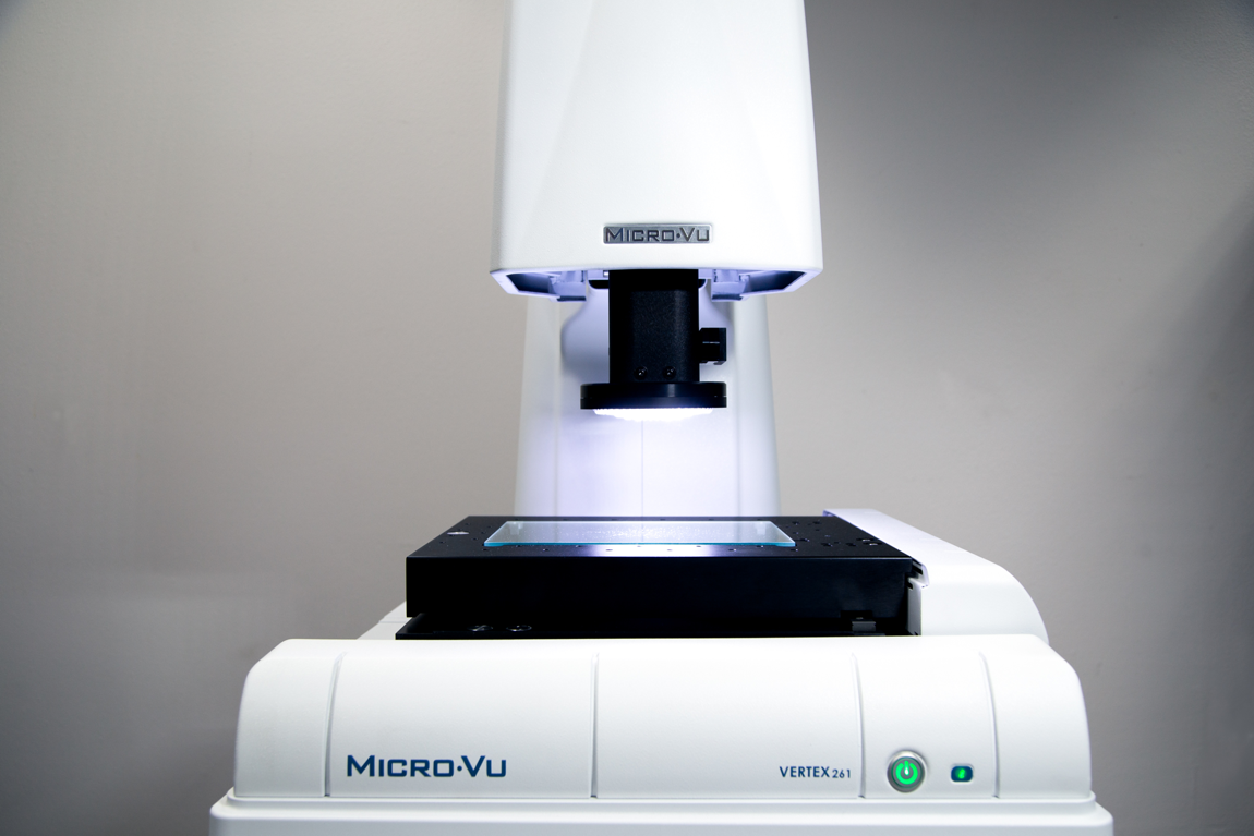 Vertex Micro-Vu Product Vertex Micro-Vu Product with white overhead light shining on viewing stage.